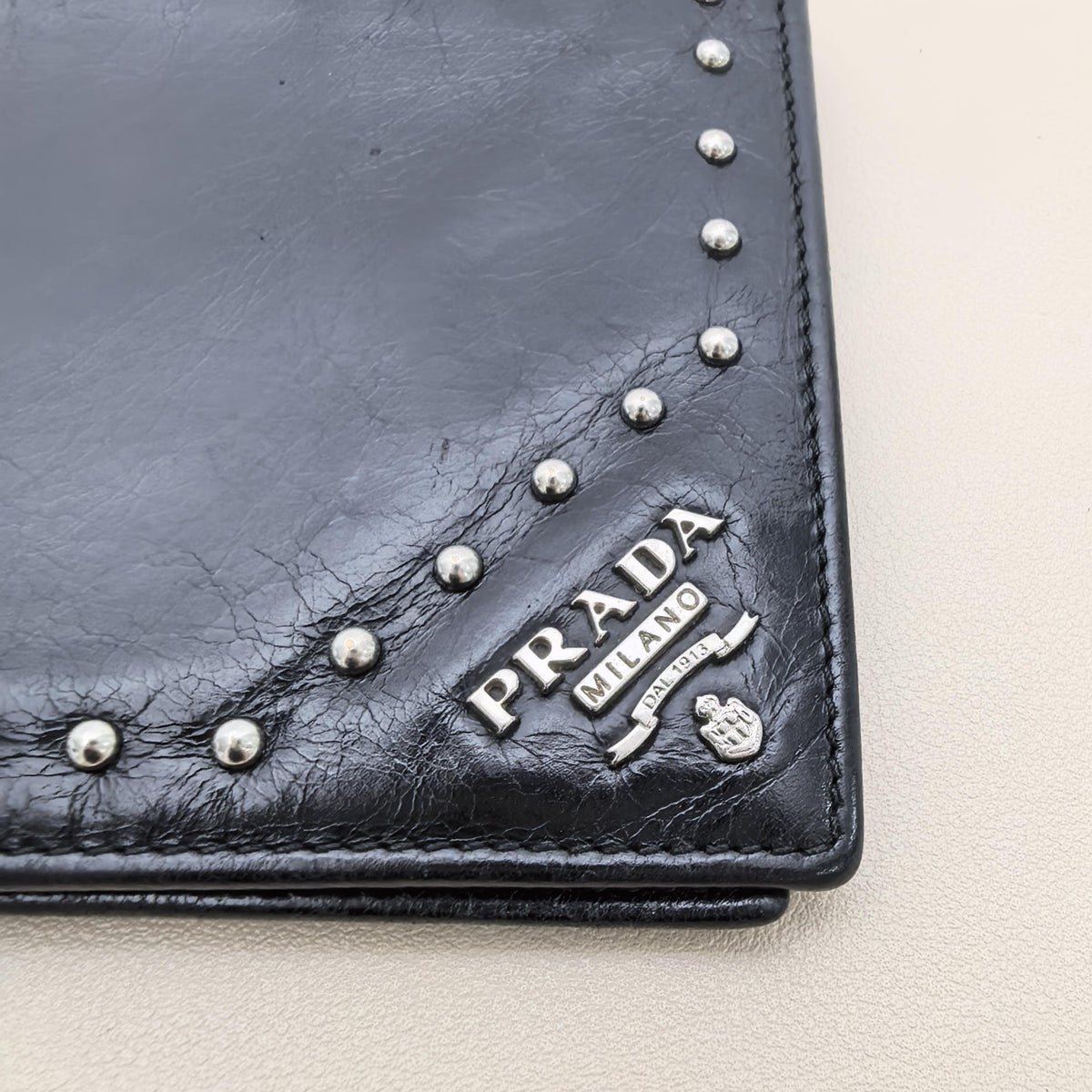 Pre-owned PRADA Calfskin Small Leather Goods Black Distressed Cracked Leather Studded Bifold Wallet