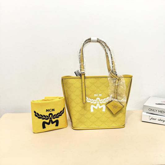 Pre-owned MCM Calfskin Tote Bags Anya Small Tote Bag (Yellow)