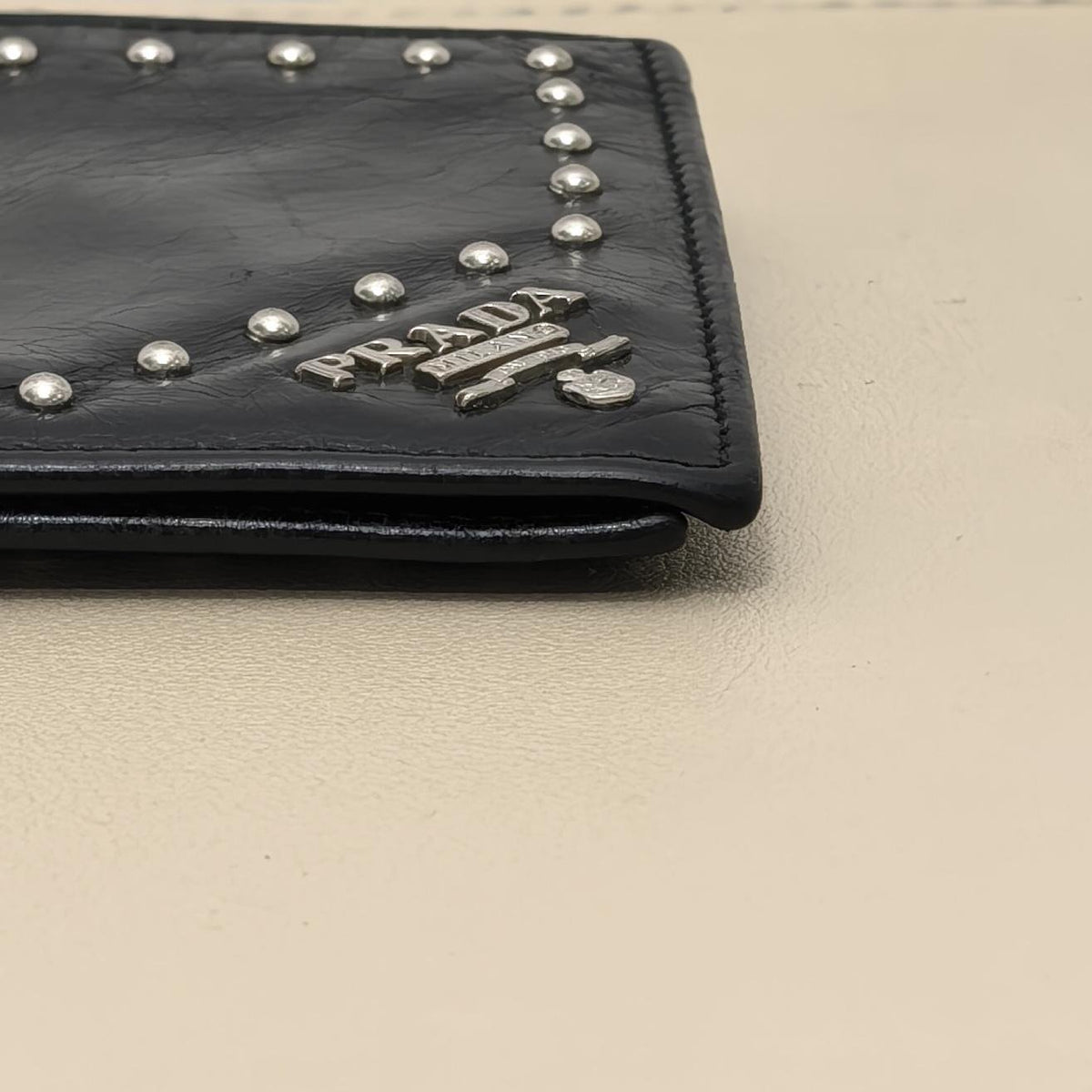 Pre-owned PRADA Calfskin Small Leather Goods Black Distressed Cracked Leather Studded Bifold Wallet