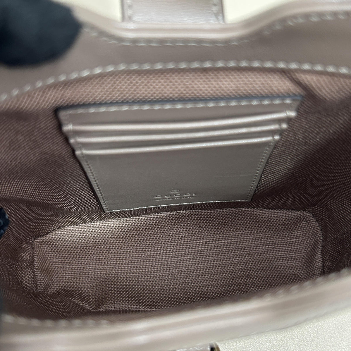 Gucci GG Embossed Leather Mini Vertical Bucket Crossbody Bag